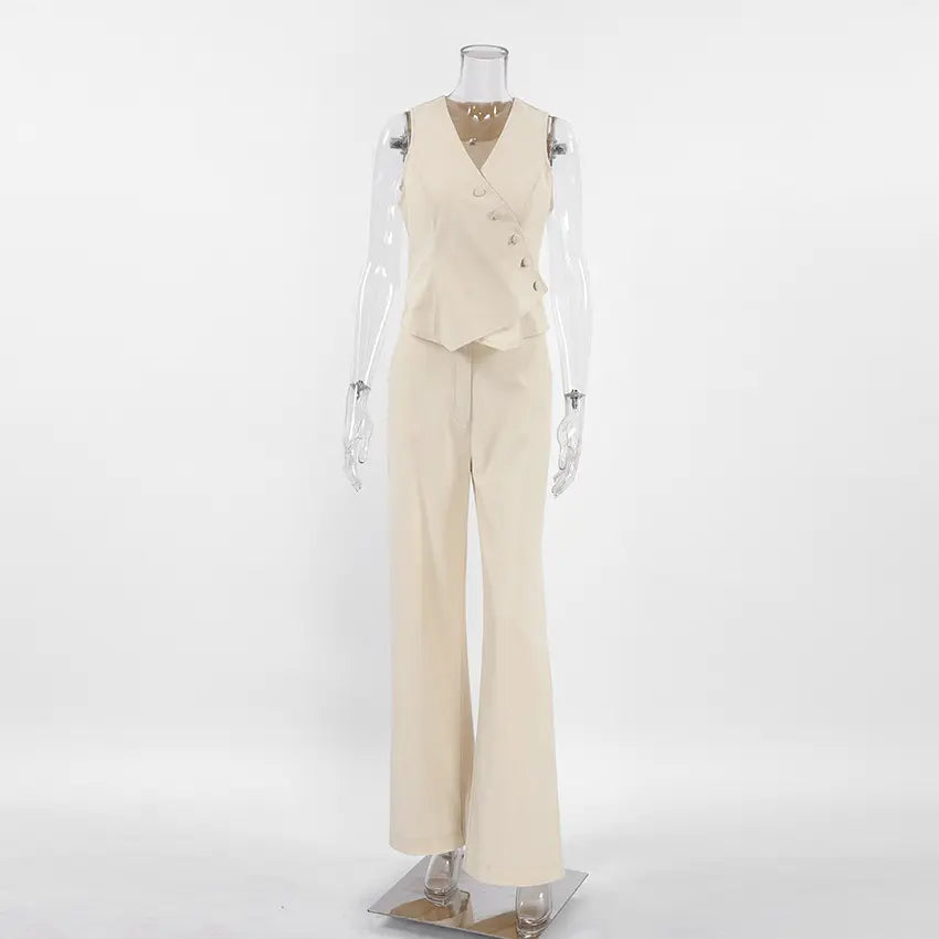 Tavrin women's beige linen-blend set featuring an asymmetrical sleeveless vest with button closure and matching wide-leg trousers. Shown front view on a mannequin.