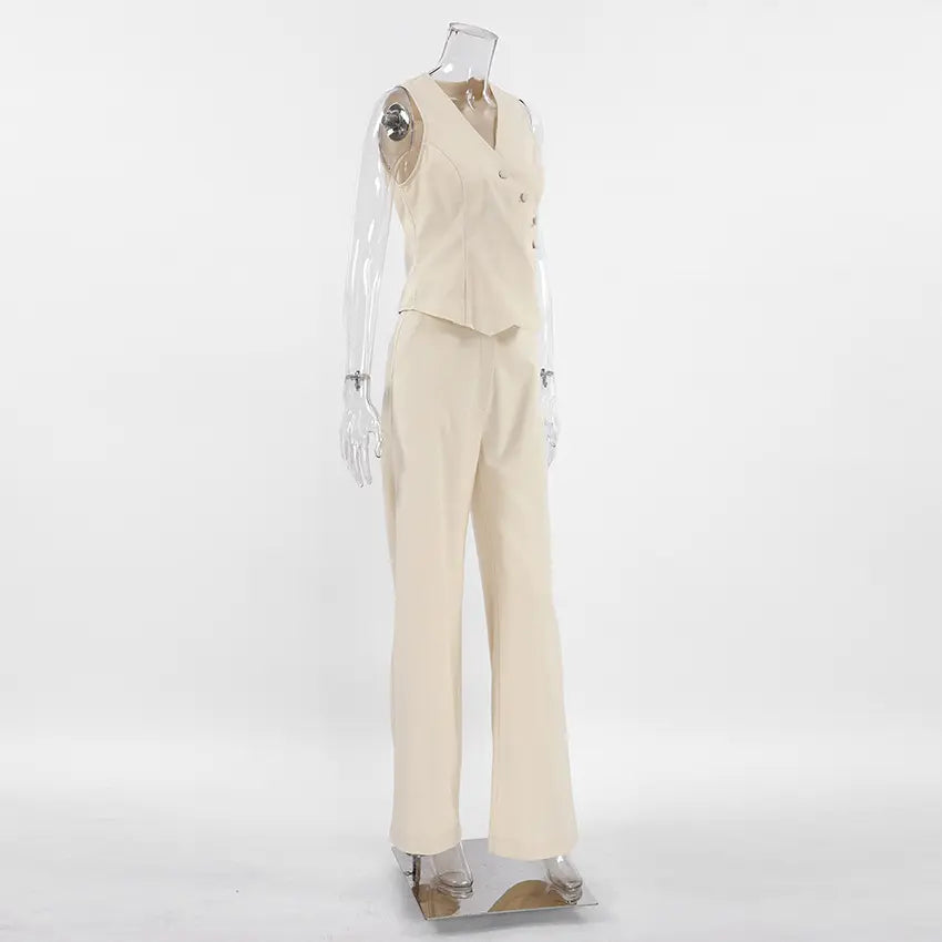 Elegant beige linen-blend women's set featuring a sleeveless vest with asymmetrical button closure and matching wide-leg trousers, shown in a three-quarter studio view.