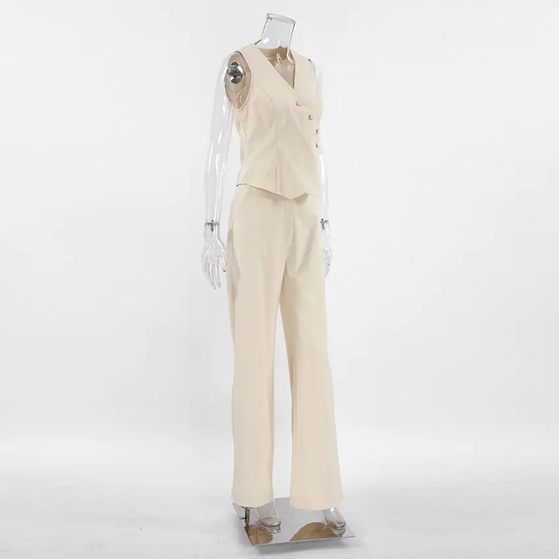 Elegant beige linen-blend women's set featuring a sleeveless vest with asymmetrical button closure and matching wide-leg trousers, shown in a three-quarter studio view.