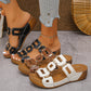 Torquin women's platform slide sandals in black, brown, and white, featuring textured interlocking straps, gold-tone hardware, and cork-effect wedge soles.