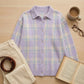 Vellura women's soft knit plaid shirt in lavender, displayed in a cozy flat-lay with coffee and a book.
