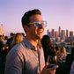 VELORA oversized aviator sunglasses featuring retro double bridge and gradient lenses, worn by a smiling man at a sunset rooftop party.