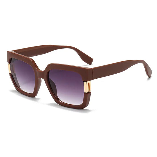 Brown Vesperia luxury oversized square sunglasses with gradient lenses and distinctive gold-tone hardware detailing at the temples.