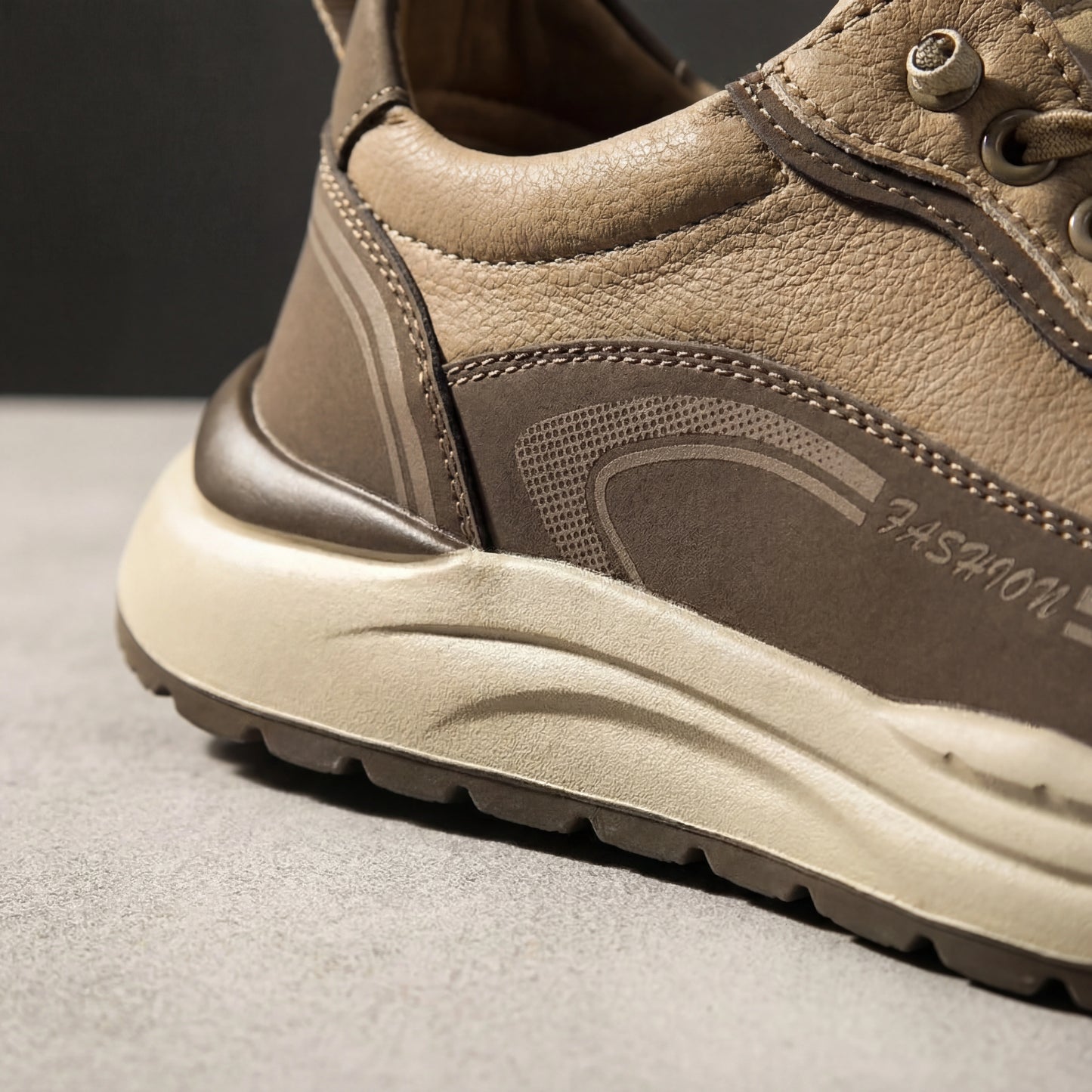 Vexor urban sneakers in khaki microfiber leather, close-up detail showing the thick shock-absorbing EVA sole and reinforced heel stitching.
