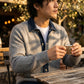 Vornex hybrid denim knit cardigan in gray worn by a man — lifestyle view showing the structured denim collar and thermal ribbed texture.