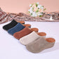 Vylos comfortable wedge mules displayed in multiple colors: black, blue, brown, cream, and taupe, featuring perforated floral uppers and white stitching.
