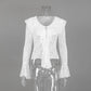 White long-sleeved lace blouse with intricate floral pattern, V-neckline, cascading ruffles, and dramatic bell sleeves, displayed on a mannequin.