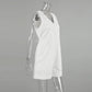 Side view of a white sleeveless linen-blend romper with a V-neck, button-down front, chest pockets, and decorative stitched hip pockets, displayed on a mannequin.