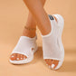 Close-up of women's white breathable mesh platform sandals worn on feet, featuring a peep-toe, cushioned white sole, and elasticated heel strap with subtle 'FSB' branding.