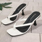 White patent heeled flip-flops with a square toe and delicate thong strap, featuring a sculptural stiletto heel and a black insole with subtle white 'FASHION' lettering.