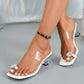 Elegant white square-toe mule sandals with clear PVC straps adorned with sparkling rhinestone embellishments and a 3-5cm clear block heel.