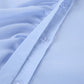 Close-up view of a powder blue collared blouse, showcasing the asymmetrical ruffle detail along the front placket and clear buttons. The smooth, subtle sheen fabric highlights the quality craftsmanship.