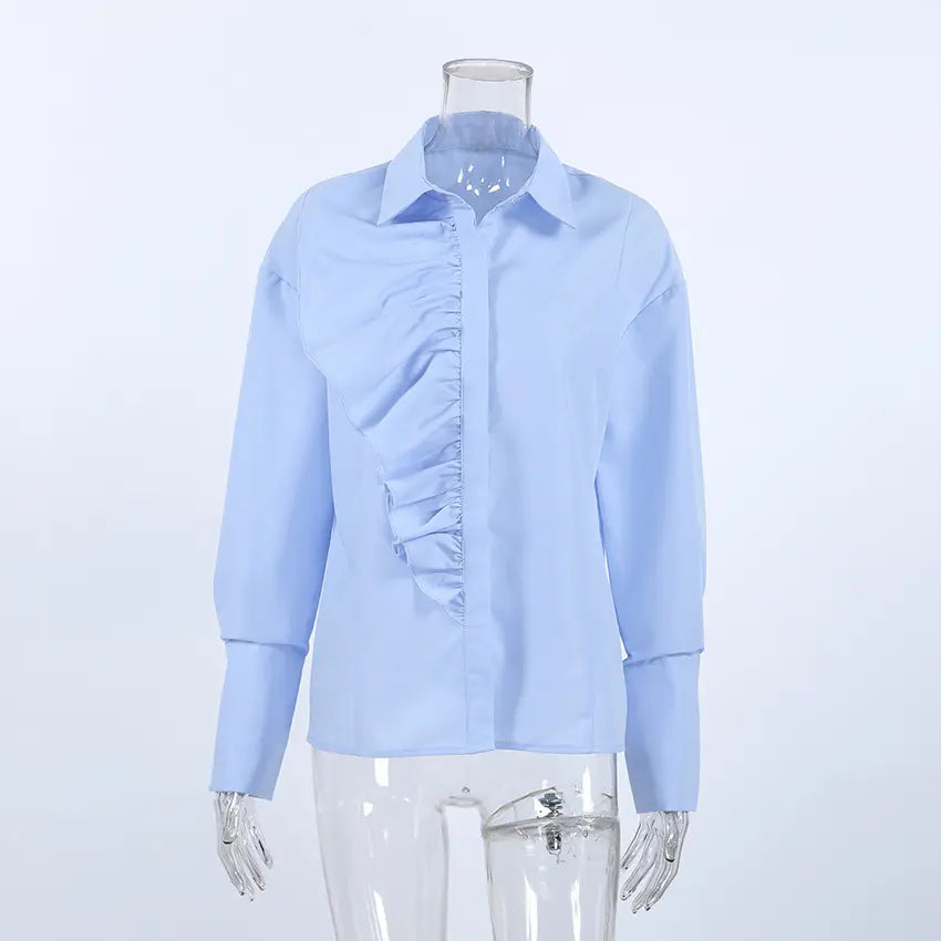 Jorvik women's powder blue collared long-sleeved blouse featuring an asymmetrical front ruffle detail, presented on a mannequin.