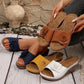 Women's open-toe wedge sandals in navy, tan, yellow, and white, featuring a large fabric rose embellishment and contrasting white stitching.