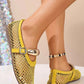 Yellow mesh flat sandals for women, featuring a patent faux leather trim and a decorative metallic buckle strap on the vamp, worn on feet with an anklet.