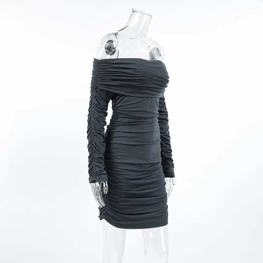 Side view of a charcoal grey Zavala off-the-shoulder mini dress featuring long ruched sleeves and all-over asymmetrical ruching for a sculpted bodycon silhouette.