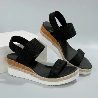 Black Zaylin women's espadrille wedge sandals featuring a peep-toe, textured mesh upper, elastic straps, and a multi-layered platform with natural jute rope detailing.