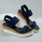 Deep ocean blue Zaylin women's espadrille wedge sandals with textured mesh upper, peep-toe, elasticated straps, and a multi-layered platform with jute rope detailing.