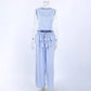 Zelphira Elegant Bohemian Set in soft lilac-blue, featuring a sleeveless ruffled crop top and flowing wide-leg trousers displayed on a mannequin. This sophisticated two-piece outfit embodies chic, romantic style.