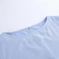 Close-up of the soft lilac-blue Zelphira bohemian set top, showing the crew neckline with a subtle zipper and a visible size 'S' tag, on a clean white background.