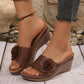 Rich Chestnut Zenthor women's slip-on wedge sandals adorned with a large fabric rose embellishment and contrasting white stitching, shown on a model's foot with jeans.