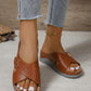 Warm Cognac Zephyra women's platform slide sandals featuring crossed straps with micro-perforations, a gold-tone buckle, and a comfortable contoured footbed on a dual-density wedge sole.