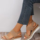 Zirath beige woven fabric espadrille wedge sandals worn by a model with blue denim jeans, featuring a fish-mouth toe and elasticated slingback strap for comfortable summer style.