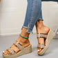 Women's Zlata glittering wedge slide sandals in metallic gold, styled with distressed denim jeans, showcasing the open toe and chunky wedge heel from a three-quarter view.