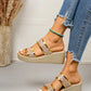 Women's Zlata metallic gold glitter wedge slide sandals with a fish-mouth peep toe, worn with distressed denim jeans against a studio background.