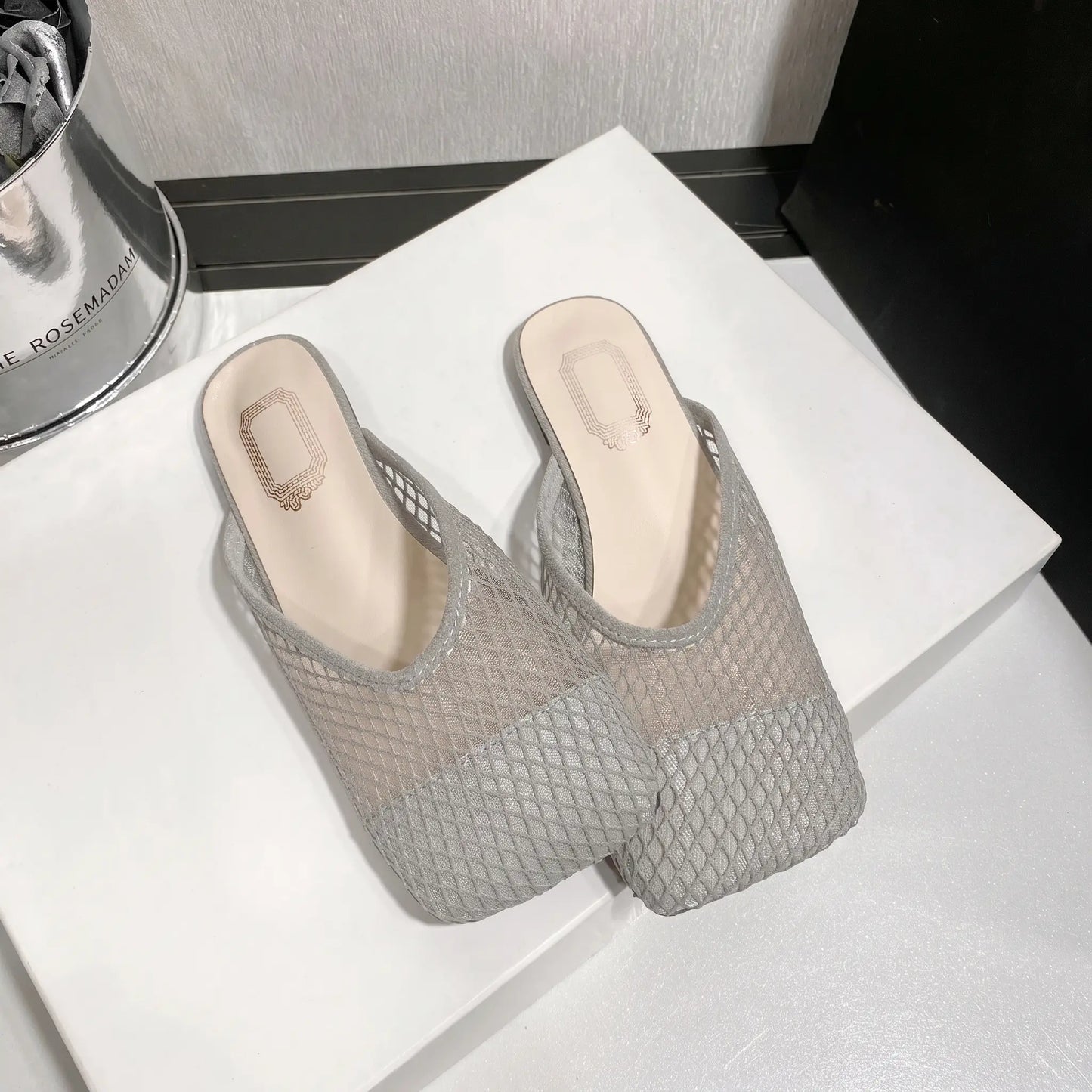 Zoria women's grey breathable mesh mules with a square toe and flat sole, presented in a studio shot.