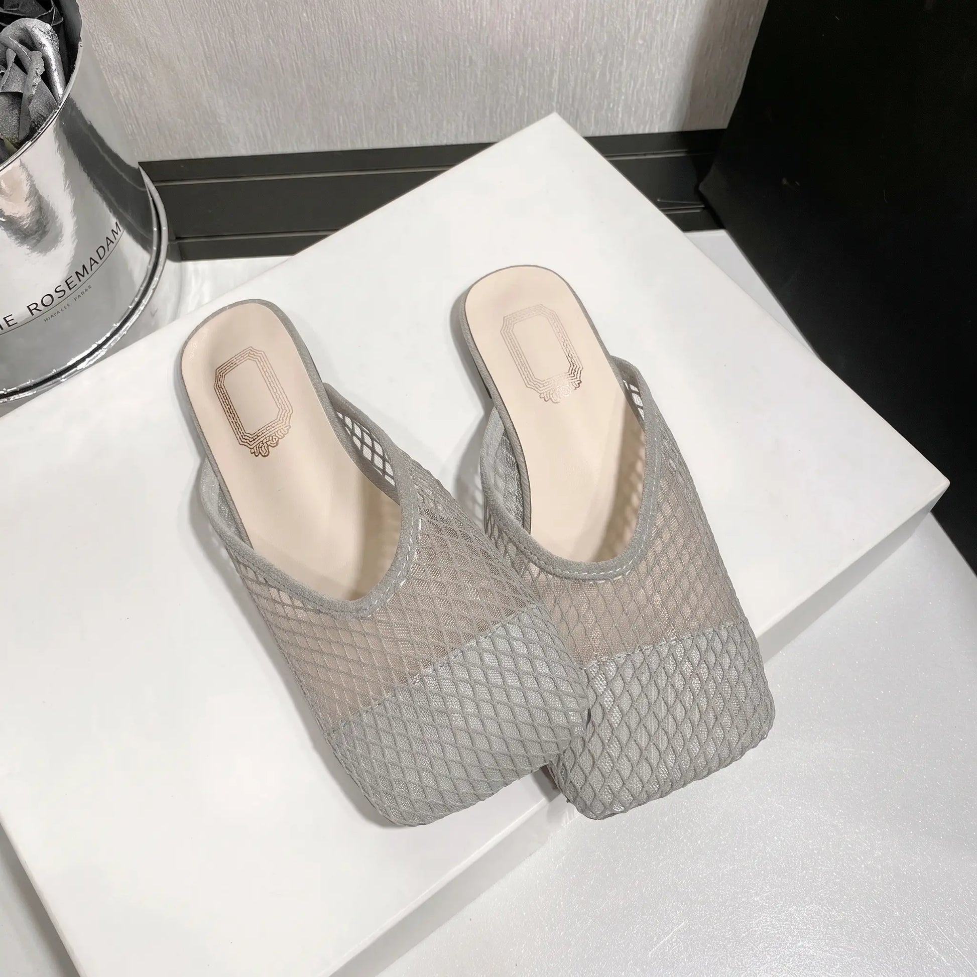 Zoria women's grey breathable mesh mules with a square toe and flat sole, presented in a studio shot.