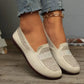 Women's Zoria warm beige breathable knit loafers with crystal-embellished vamp and a geometric pattern, styled with denim jeans.