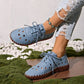 Zoryn women's light blue perforated lace-up loafers worn with distressed jeans and a turquoise anklet, showcasing breathable summer comfort.