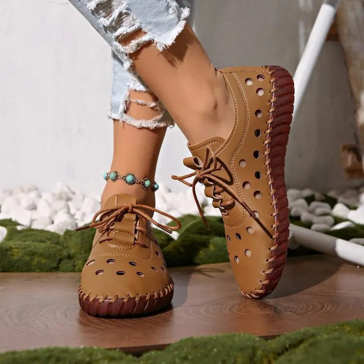 Zoryn women's tan perforated lace-up loafers worn with distressed jeans and a turquoise anklet, showcasing bohemian summer style and breathability.