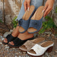 Zylaya elegant wedge sandals in dusty blue, black, beige, and white, showcasing floral applique and perforated straps on a lifestyle outdoor setting.