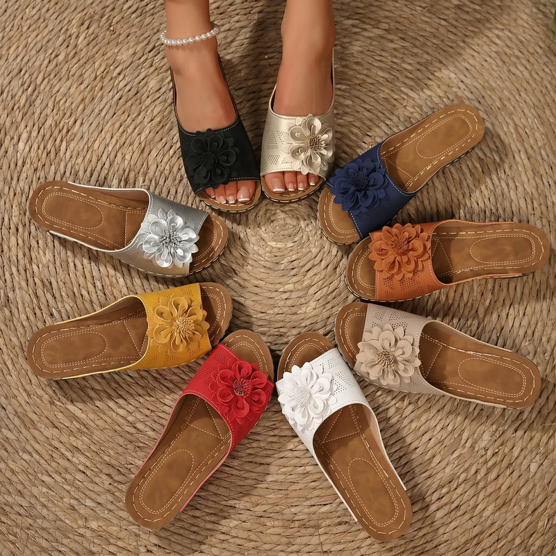 Zylia women's casual summer sandals in multiple colors, featuring perforated straps adorned with layered floral embellishments and white contrast stitching. Seen from a top-down perspective.