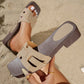 Chic Zyloria women's flat slide sandals featuring a square toe, layered faux suede straps in beige with a leopard print detail, and a dark brown wood-effect stacked heel, shown on a sandy beach.