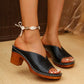 Zylos black metallic V-cut mules with white contrast stitching and chunky wood-effect block heels, worn on a model's feet with a shell anklet.