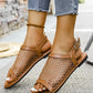 Elegant brown Zylos mesh flat sandals with faux leather straps and a silver buckle, shown worn on feet with denim jeans.