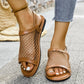 Zylos cognac brown flat mesh sandals for women, featuring a round toe, PU leather accents, and an adjustable buckle strap closure, shown worn outdoors.