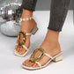 Zylos women's chic square toe slide sandals in creamy ivory, featuring a statement oversized gold buckle and a comfortable block heel, worn on feet.