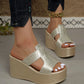 Zylos gold metallic embossed PU platform wedge sandals styled with dark wash jeans and a gold chain anklet.
