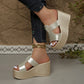 Zylos gold metallic embossed PU leather wedge sandals with a 10cm heel and 4cm platform, styled with dark denim jeans and a gold anklet.