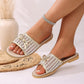 Elegant Zylos mesh bow slide sandals in lustrous gold, shown on a model's feet with clean nails, styled for summer fashion. Delicate mesh upper with a central bow detail and a braided sole trim.
