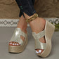Zylos gold metallic embossed PU leather platform wedge sandals worn with dark denim jeans and a gold chain ankle bracelet, showcasing the 10cm heel and 4cm platform.