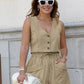 Woman wearing a Zylos summer linen blend set in soft khaki, featuring a V-neck sleeveless vest and high-waisted drawstring shorts with patch pockets, styled with white sunglasses.
