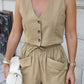 A woman models a Zylos Khaki linen blend sleeveless vest and drawstring shorts set, showcasing its breathable fabric and relaxed fit with cargo pockets.