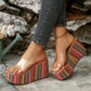 Zylpha bohemian platform wedge sandals with vibrant multi-color stripes and clear PVC strap, worn with denim jeans.