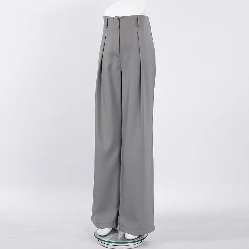 Zyntra elegant wide-leg trousers in a sophisticated cool grey hue, featuring a high-waist design and sharp front pleats for a fluid drape. Shown from the front on a clean white studio background.