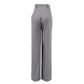 Back view of Zyntra elegant grey wide-leg trousers showcasing their fluid drape, high waist, and smooth fabric construction.